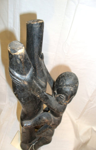 Statue Of  A Boy Climbing Tree Ghana